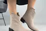 Ботинки казаки женские замшевые бежевого цвета на каблуке демисезонные Фото 1