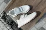 Кросівки жіночі шкіряні білого кольору Фото 11
