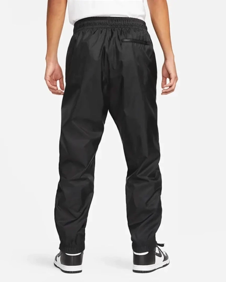 Брюки чоловічі Nike Windrunner (DX0653-011) фото 2 — інтернет-магазин Tapok