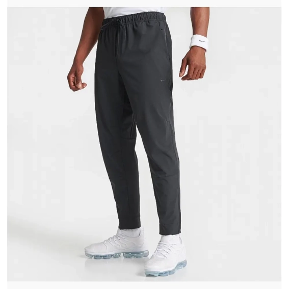 Мужские брюки Nike Dri-Fit Unlimited Tapered Leg (FB7548-010) фото 1 — интернет-магазин Tapok
