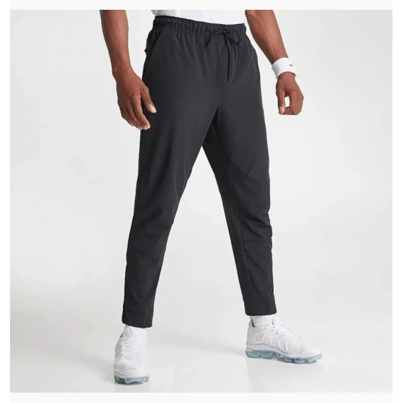 Мужские брюки Nike Dri-Fit Unlimited Tapered Leg (FB7548-010) фото 2 — интернет-магазин Tapok