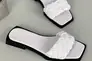 Шльопанці жіночі шкіряні білого кольору на чорній підошві Фото 8