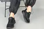 Кросівки жіночі з нейлону чорного кольору зі вставками шкіри та замші. Фото 9